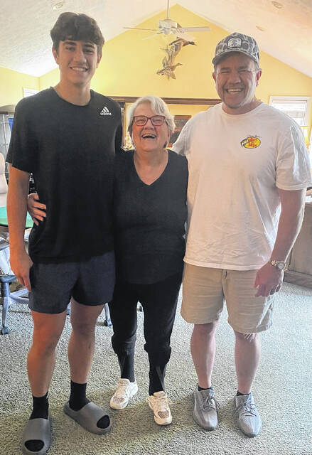 130720745_web1_ethan-with-dad-and-coaches-widow
Pictured is Easley High Schools basketball standout Ethan Crews (left) with his dad (right) and Sandy Jones Scahill. Crews has traveled this summer to play against some high-level competition.
Photo Submitted