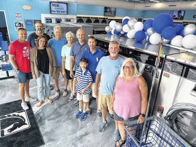130774920_web1_Super-Clean-Laundry-pix-72424
Pictured is Super Clean Laundry owner Matthew Henderson (dark blue shirt fourth from the right) with family and friends on Saturday at their ribbon cutting. Henderson is a 1997 graduate of Seneca High School.
Courtesy photo