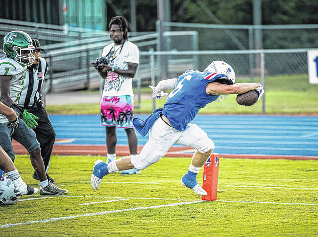 130852654_web1_Pickens-RB-Carter-McCollum--6--TD-run-1Q
Pickens High School senior Carter McCollum scores a first-quarter touchdown on Friday night in a 47-41 win over Easley in overtime.
Scott Schroeder | The Easley Progress