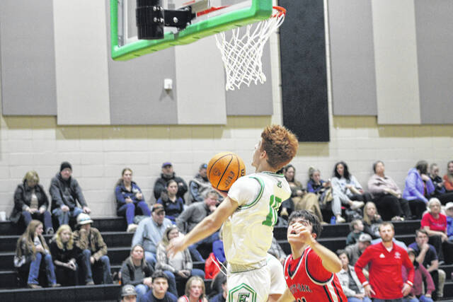 131117646_web1_Noah-for-EHS-layup
Easley High School senior Noah Calhoun scores on an up-and-under move last week against West Oak. The Green Wave took care of business quickly with an 85-24 victory.
Jeff Holt | The Easley Progress