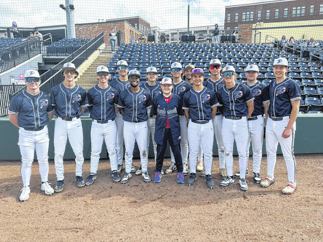 131368720_web1_Cancer-kid-with-PHS-baseball-team
Pictured is Samuel David Hood (center) with the Powdersville High School baseball team on Saturday right before their game with River Bluff. Hood was recently diagnosed with cancer and was able to sit in the dugout at the Fluor Field in Greenville.
Jeff Holt | The Easley Progress