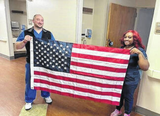 
			
				                                Pictured is Colt Shope and Alycia Fuller holding the U.S. Flag. They help with honoring the military veterans in their closing moments of their life with special dignity and gratitude. 
                                 Photo submitted

			
		