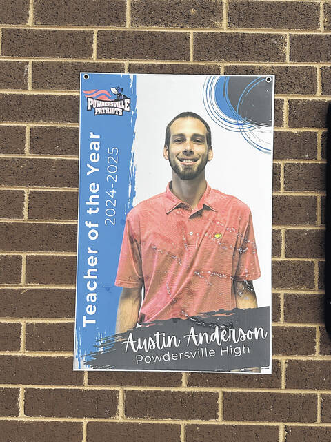 131512585_web1_Austin-Anderson-poster-at-PHS
Pictured is the poster of Austin Anderson as the Teacher of the Year as you walk in the front door of Powdersville High School. Anderson is beginning a new journey in life next year at Easley High School in teaching and as the varsity boys basketball coach for the Green Wave.