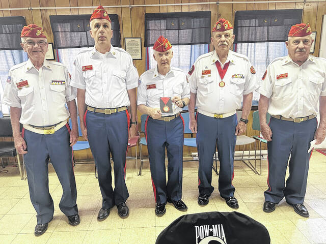 131531159_web1_Mike-Merrill-group-picture
Mike Merrill (center) received the Marine of the Year award recently at the monthly meeting of the local Marine Corps League.
Photo Submitted