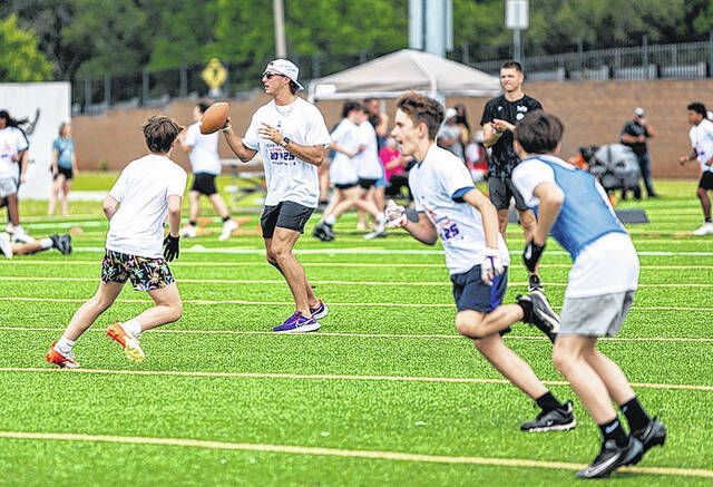 131586214_web1_Cade-Klubnik-Clemson-QB-2025-1
Clemson QB Cade Klubnik looks for an open receiver on Saturday morning at the Youth Football Camp.
Photo by Mark Beery