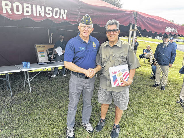 <p>Richard Mintz of Post 52 helped honor all the winners of the specialty cars on Saturday for the Car, Truck and Bike Show on Saturday in Powdersville. The event was put on by Robinson Funeral Home and members of Post 52 helped with the judging of the best vehicles.</p>
<p>Jeff Holt | The Easley Progress</p>