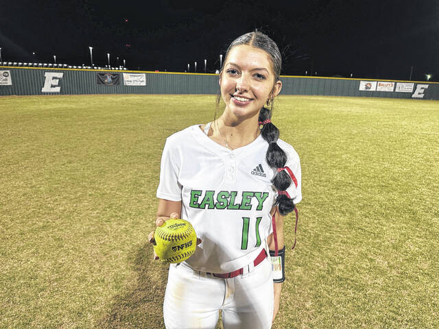 Easley High School senior Abby Wade holds the game ball after throwing a 1-hitter last week in a 16-0 win over over Pickens in five innings. Wade turned in the memorable performance for her dad who passed away three years ago to the day.
                                 Jeff Holt / The Easley Progress