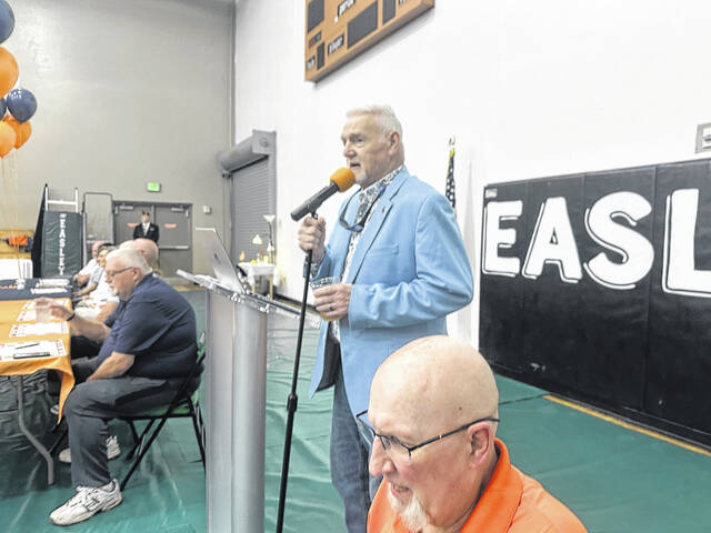 Pictured is Steve Garrison with the Invocation to the Easley Post 52 Hall of Fame Induction banquet on Friday night at the Larry Bagwell Gymnasium. Garrison starred at first base for Post 52 and he also helped put on this big event.
                                 Jeff Holt / The Easley Progress